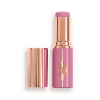 CHARLOTTE TILBURY UNREAL LIP + CHEEK GLOW BLUSH STICK WITH HYALURONIC ACID