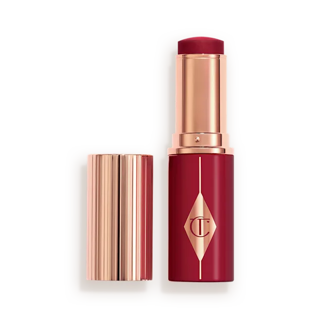 CHARLOTTE TILBURY UNREAL LIP + CHEEK GLOW BLUSH STICK WITH HYALURONIC ACID